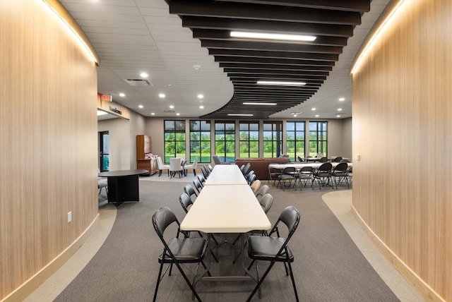 dining space with visible vents, recessed lighting, carpet floors, wood walls, and baseboards