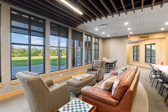 carpeted living room with visible vents, recessed lighting, and baseboards