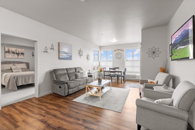 living room with baseboards and wood finished floors