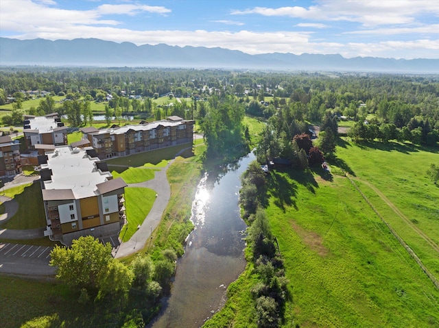 drone / aerial view featuring a water and mountain view