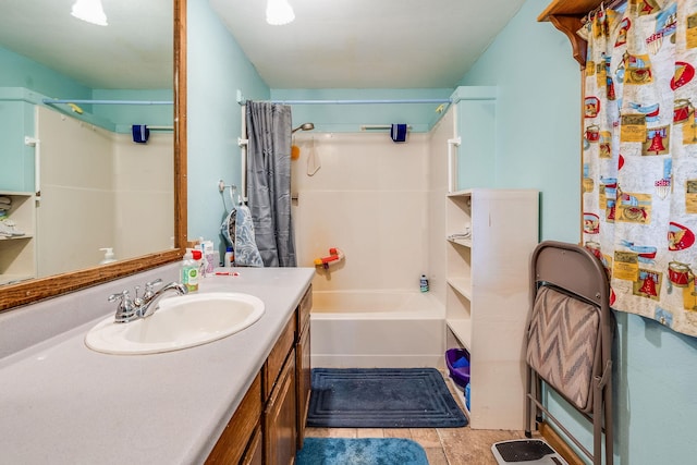 full bathroom featuring vanity and shower / bath combo with shower curtain