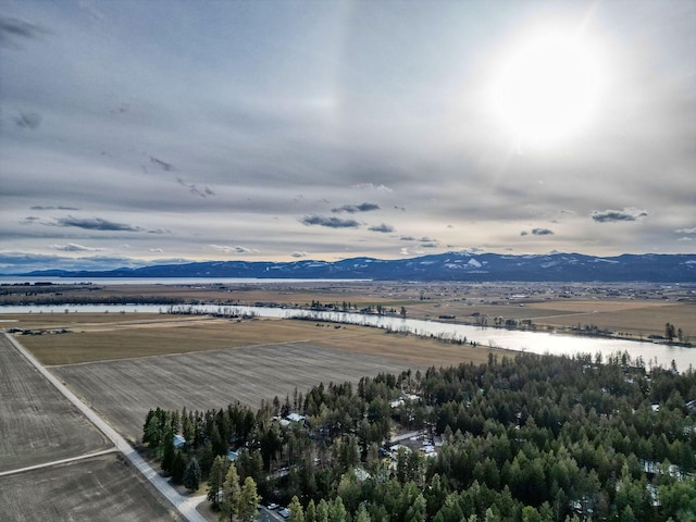 bird's eye view with a water and mountain view