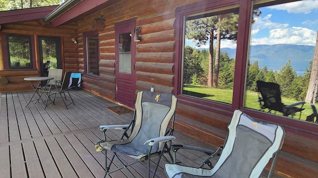 wooden terrace featuring a mountain view