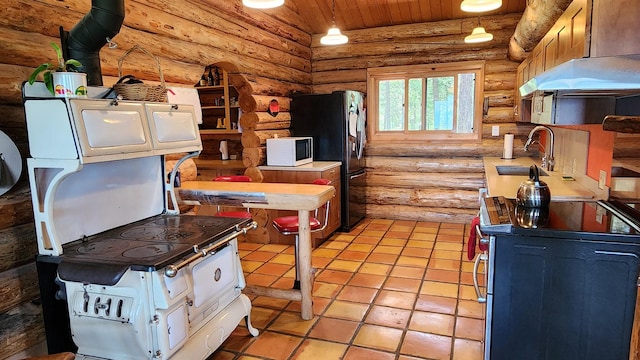 kitchen featuring stainless steel electric range oven, white microwave, freestanding refrigerator, a sink, and wood ceiling