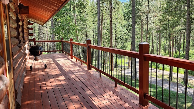 deck featuring a forest view