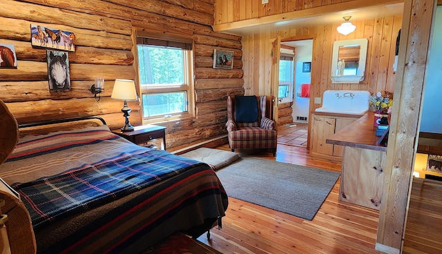 bedroom with hardwood / wood-style floors