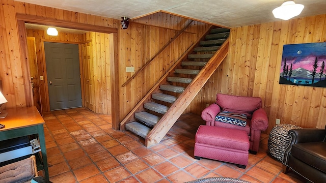 staircase with wooden walls