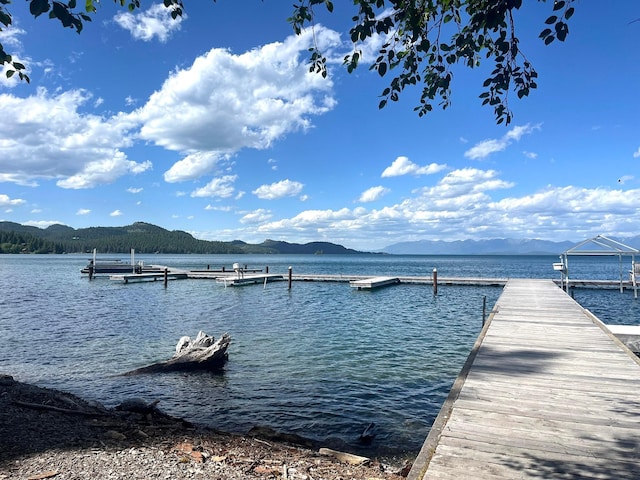 dock area featuring a water and mountain view