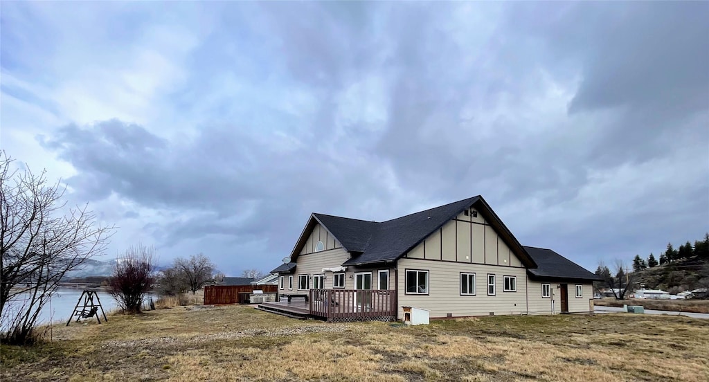 view of property exterior with a deck and board and batten siding