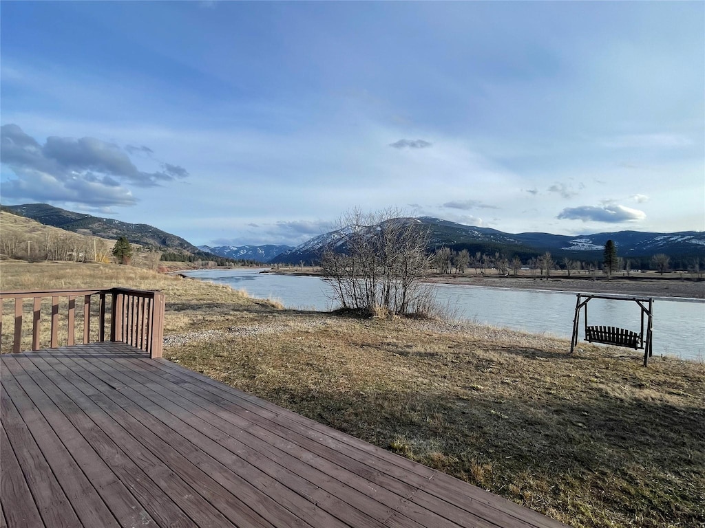 deck featuring a water and mountain view