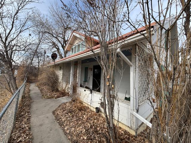 view of side of home with fence