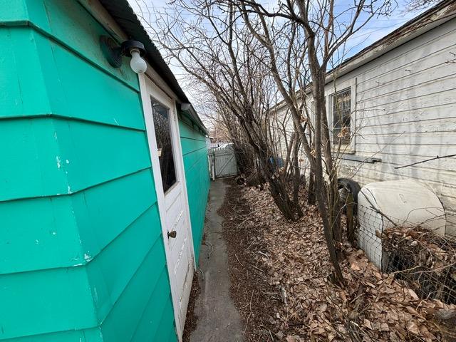 view of side of home with fence