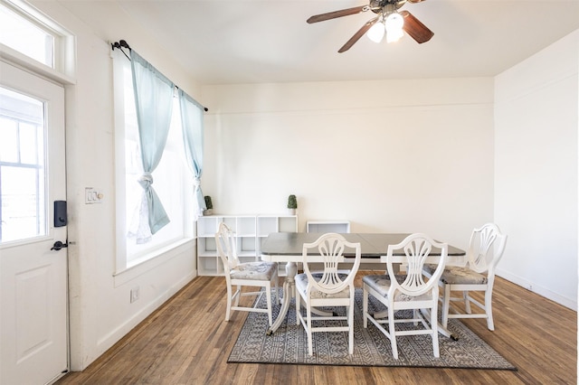 dining area with plenty of natural light, baseboards, and wood finished floors