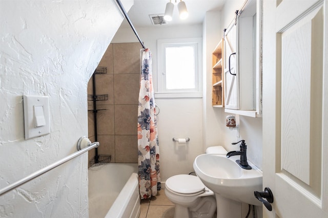 bathroom featuring visible vents, shower / bath combo with shower curtain, toilet, a sink, and tile patterned flooring