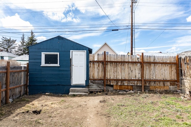 view of shed with a fenced backyard