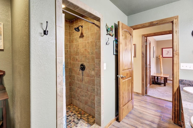 7415 Wildcat St, Helena, MT 59602 - bathroom featuring a shower stall, wood finished floors, and vanity