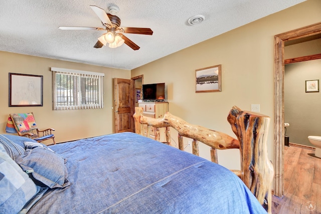 7415 Wildcat St, Helena, MT 59602 - bedroom with wood finished floors, a textured ceiling, ceiling fan, and baseboards