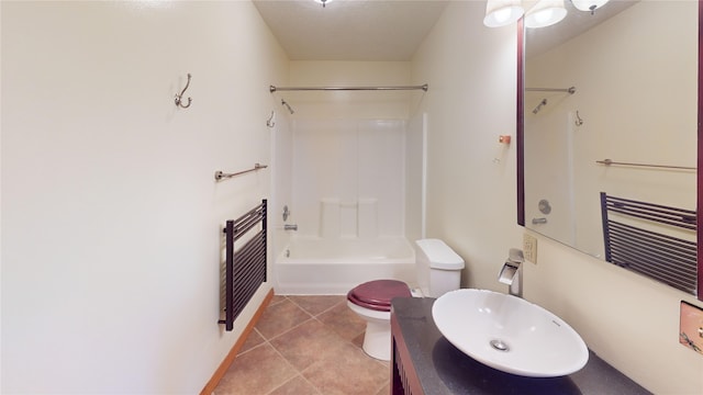 full bathroom with vanity, heating unit, tile patterned flooring, toilet, and shower / bathtub combination