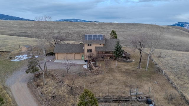 birds eye view of property with a mountain view