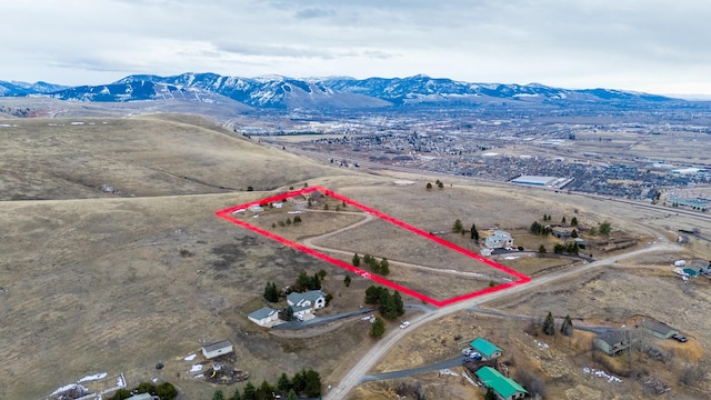 drone / aerial view with a rural view and a mountain view