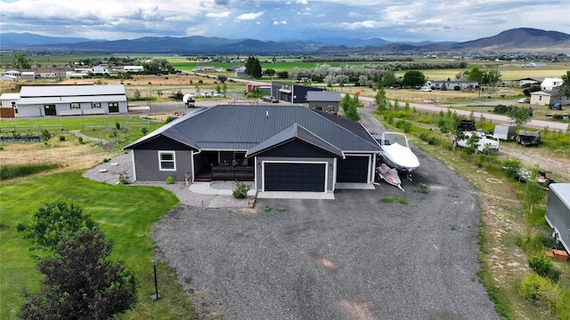 aerial view featuring a rural view and a mountain view