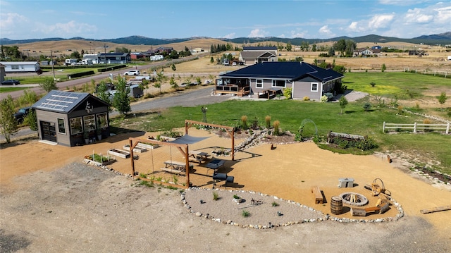 birds eye view of property with a rural view and a mountain view