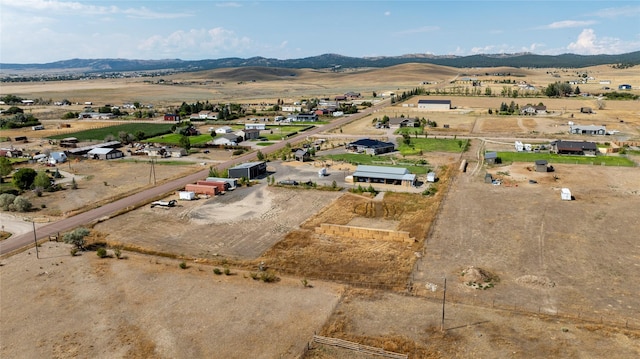 drone / aerial view featuring a rural view and a mountain view