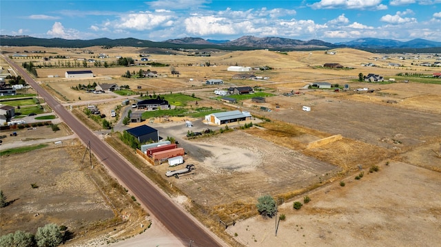 drone / aerial view with a rural view and a mountain view