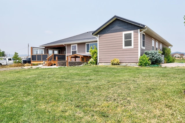 back of house featuring a yard