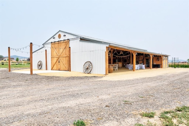 view of outbuilding featuring an exterior structure and an outdoor structure