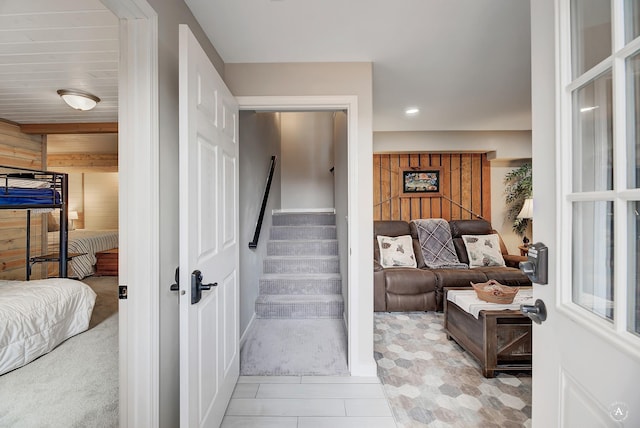 stairs with recessed lighting and wooden walls