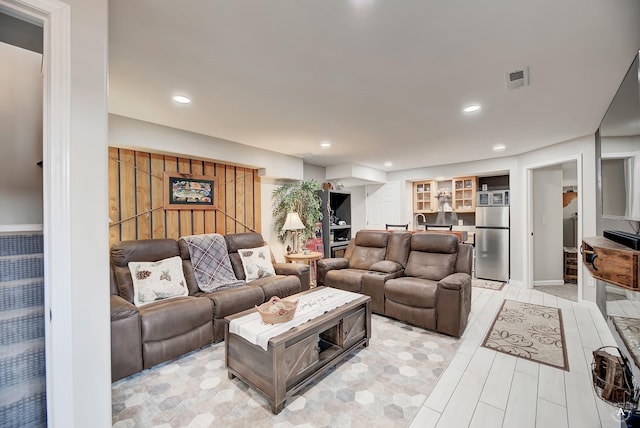 living room featuring recessed lighting