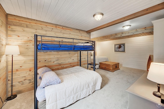 bedroom featuring carpet and wooden walls