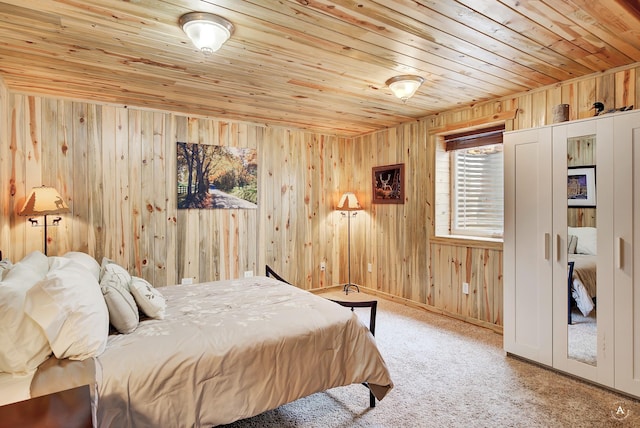 carpeted bedroom with wooden walls and wooden ceiling