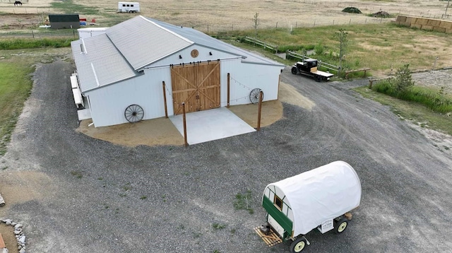 birds eye view of property featuring a rural view