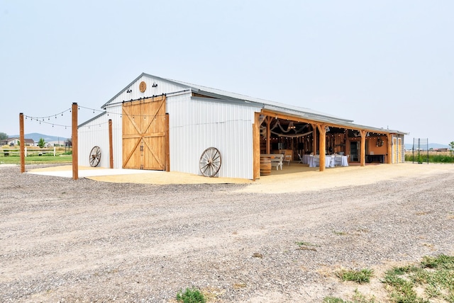 view of outbuilding with an exterior structure and an outdoor structure