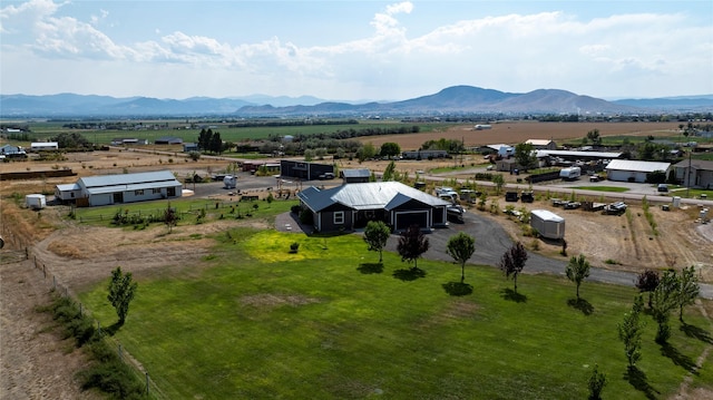 birds eye view of property with a mountain view and a rural view