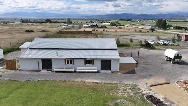 drone / aerial view with a rural view and a mountain view