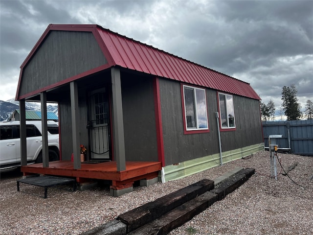 view of outbuilding with an outbuilding and fence