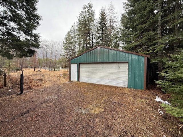 detached garage featuring driveway