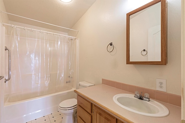 bathroom with vanity, toilet, and shower / tub combo