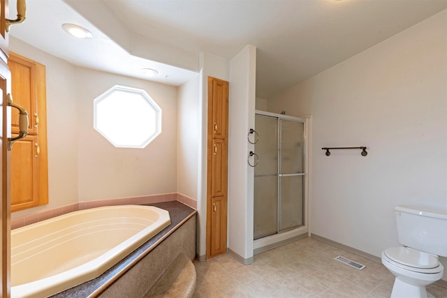 full bathroom with visible vents, toilet, a stall shower, and a garden tub