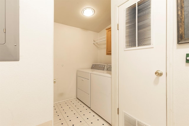 laundry room with light floors, visible vents, electric panel, separate washer and dryer, and cabinet space