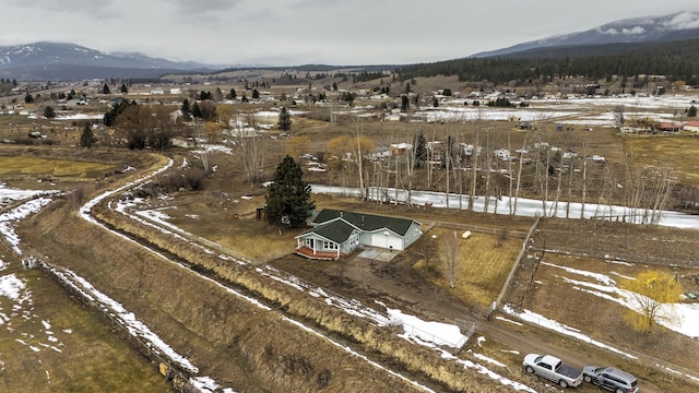 bird's eye view featuring a mountain view and a rural view