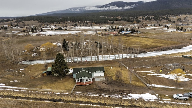 drone / aerial view featuring a mountain view and a rural view