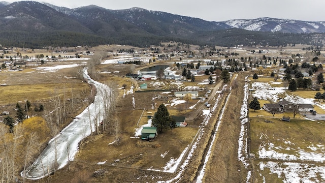 drone / aerial view with a mountain view and a rural view