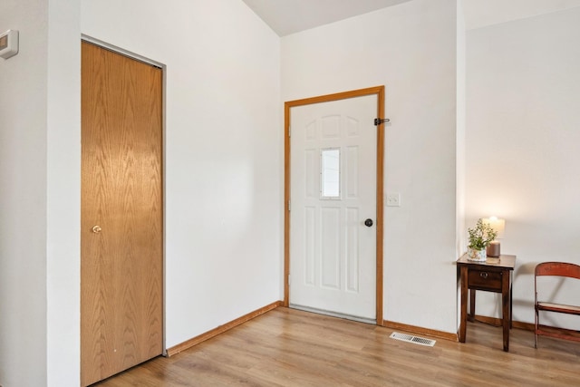 entryway with visible vents, baseboards, and light wood-style floors