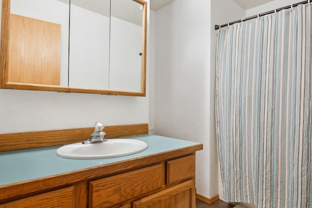 full bath with vanity and a shower with shower curtain