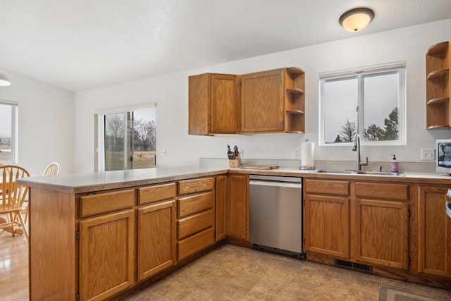 kitchen featuring a sink, a peninsula, stainless steel appliances, and open shelves