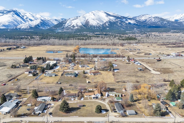 birds eye view of property with a mountain view